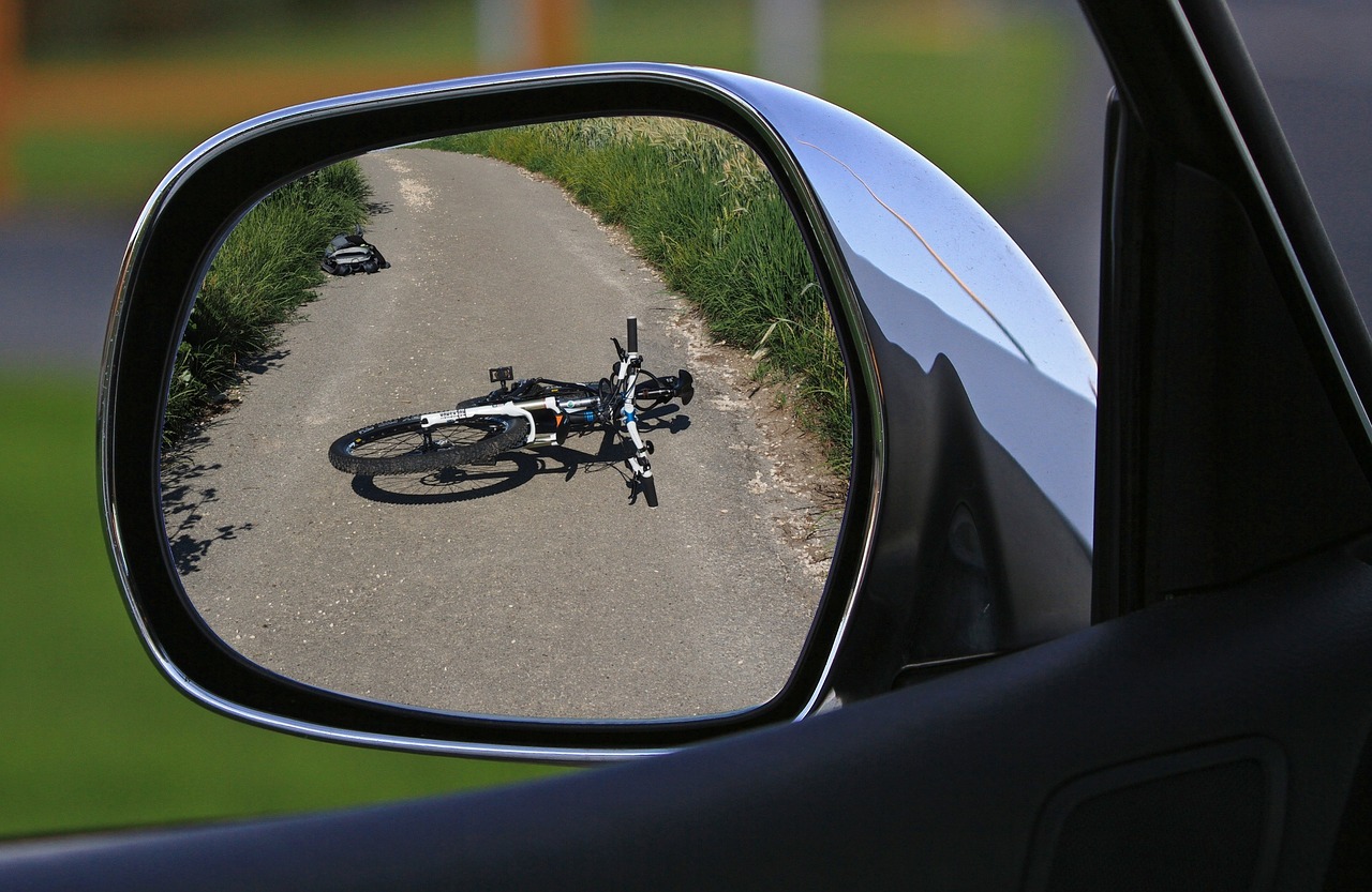 a bike fallen over after being in a car accident