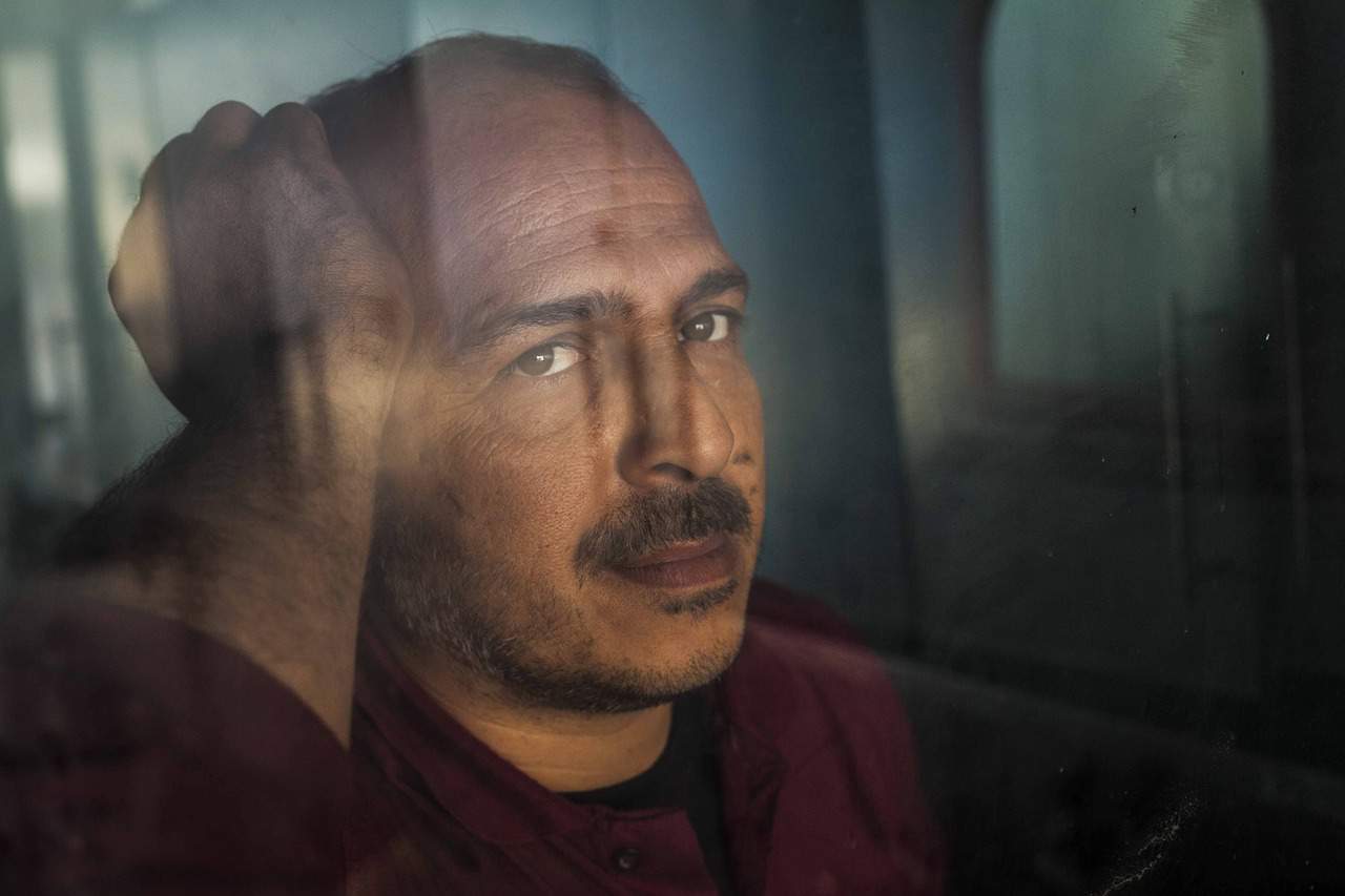 man staring out the window