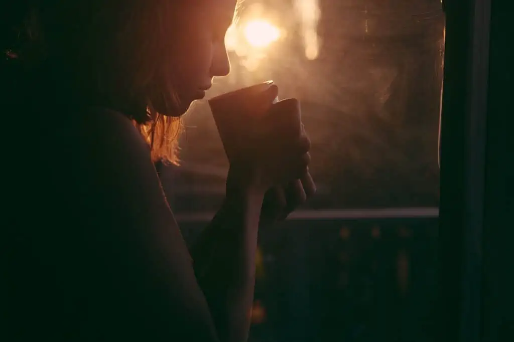 woman drinking a cup of coffee in the morning