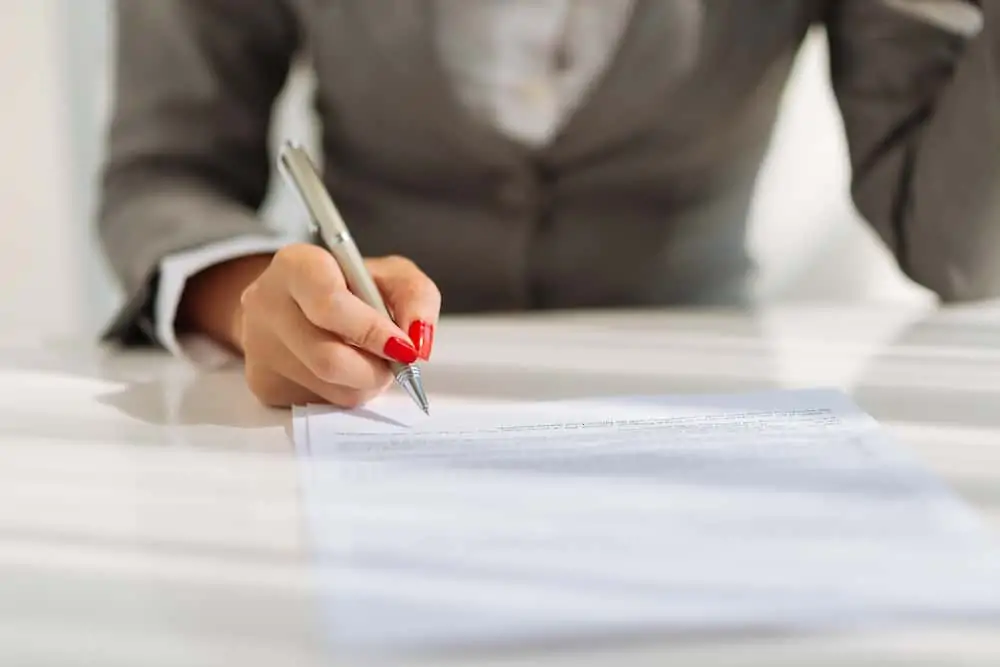 person reading through a legal document