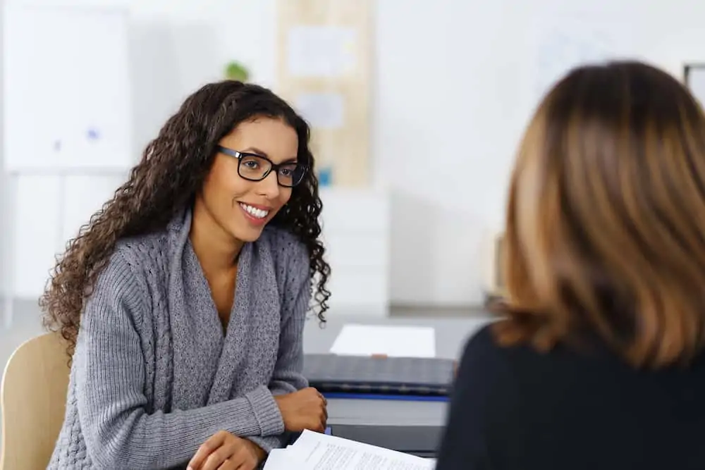 lawyer discussing an insurance dispute with a client