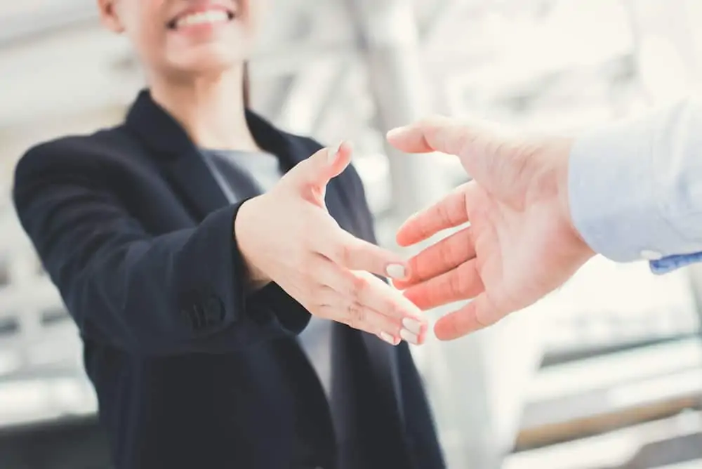 two people shaking hands